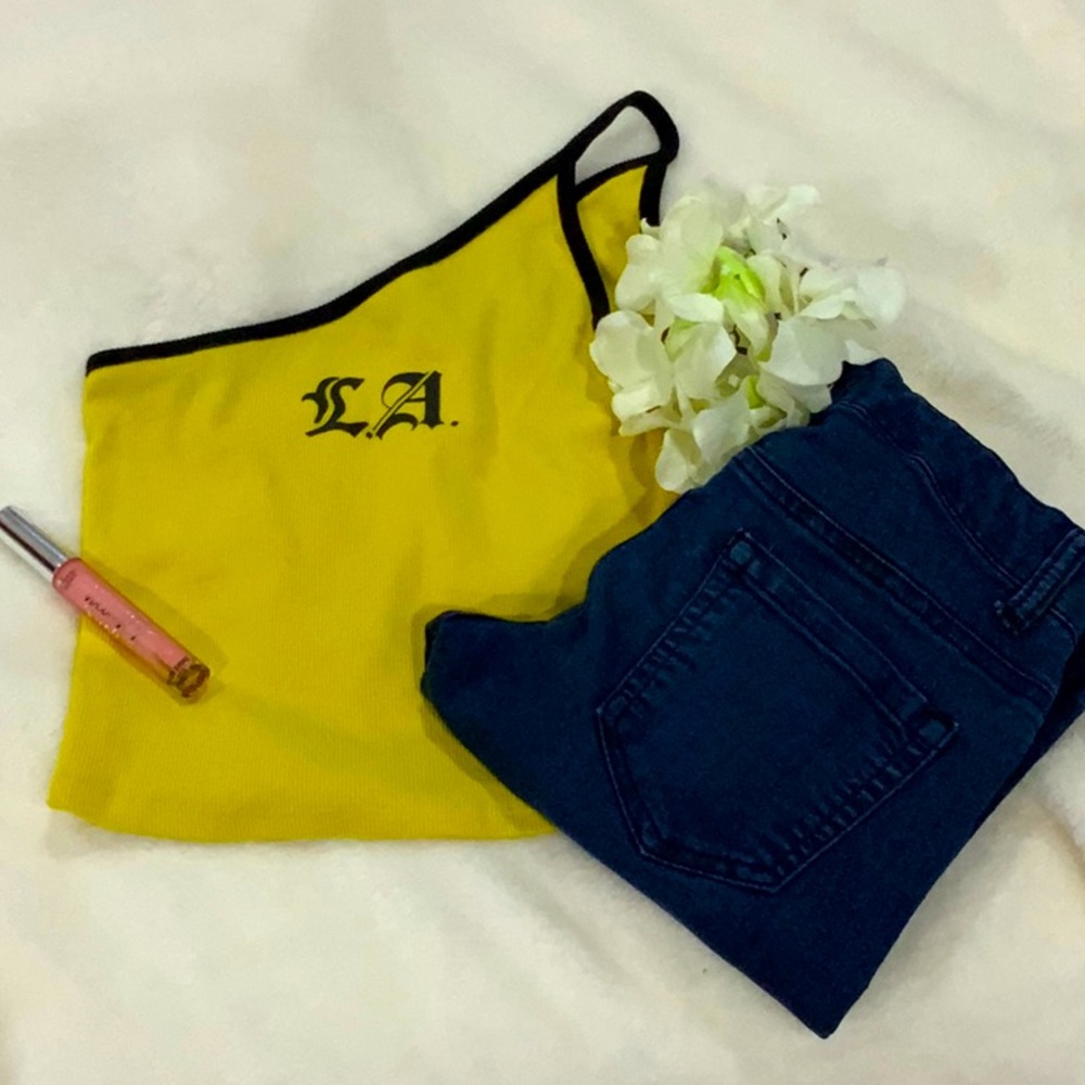 A one off the shoulder tank top